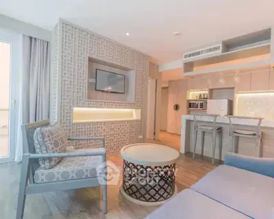 Modern living room with stylish decor and open kitchen layout