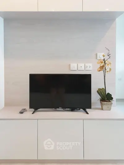 Modern living room with sleek TV setup and elegant decor