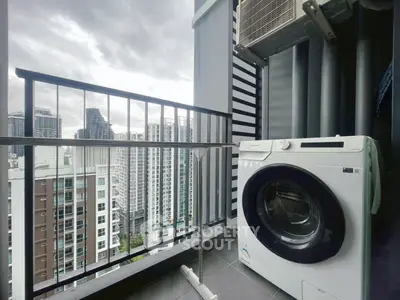 Modern balcony with washing machine and city view, perfect for urban living.