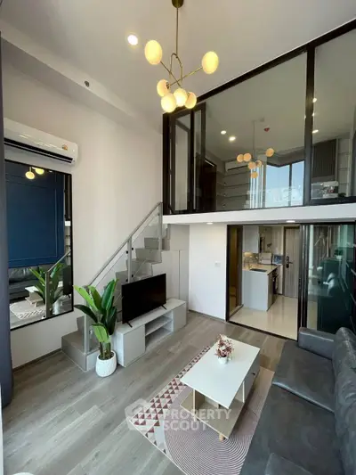 Modern duplex living room with stylish decor and open kitchen layout