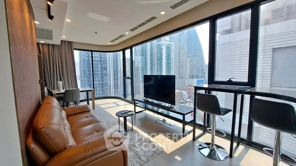 Luxurious modern living room with panoramic city views and stylish furnishings.