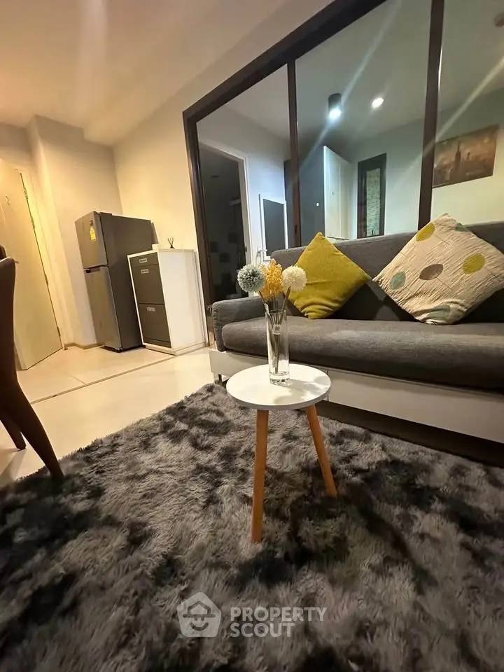 Cozy living room with modern decor and plush rug