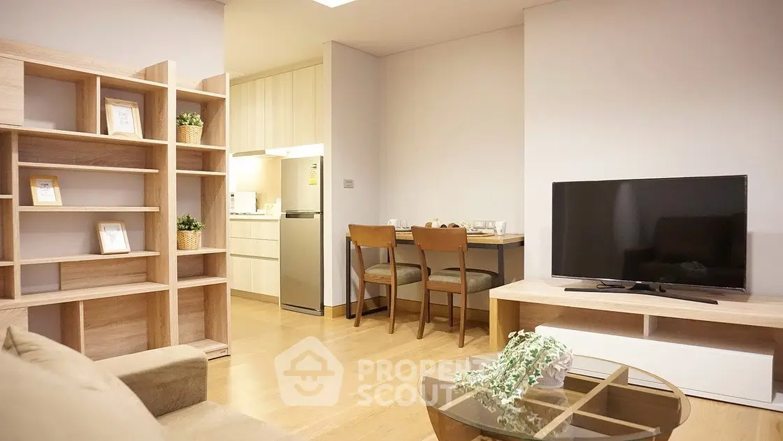 Modern living room with open kitchen, stylish furniture, and cozy ambiance