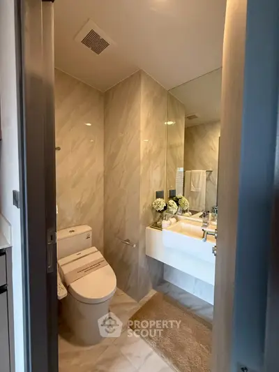 Modern bathroom with sleek fixtures and elegant marble walls