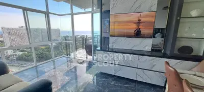 Luxurious living room with stunning ocean view and modern marble decor