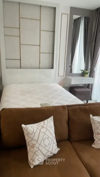 Modern bedroom with stylish decor and comfortable furnishings in a contemporary apartment.