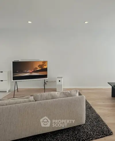 Modern living room with sleek TV setup and minimalist decor