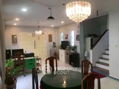 Spacious living room with elegant chandeliers and modern decor