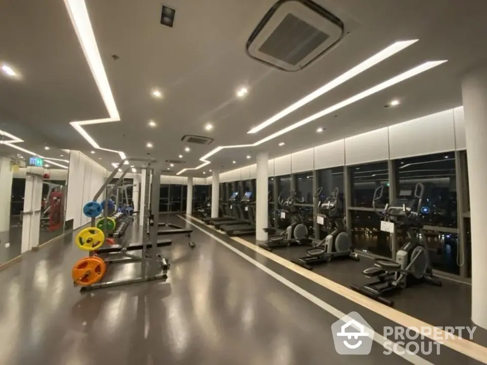 Modern gym with state-of-the-art equipment and panoramic city views