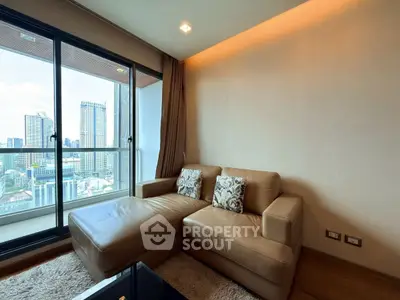 Modern living room with city view, featuring a cozy leather sofa and large windows for natural light.