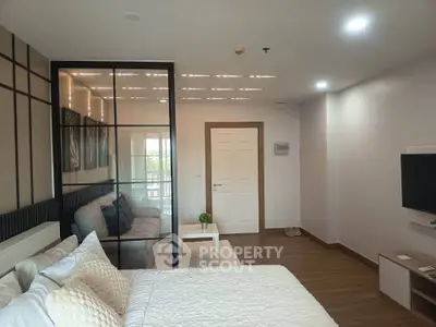 Modern studio apartment with stylish partition and cozy decor