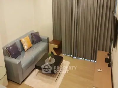 Cozy living room with modern sofa and stylish decor in a contemporary apartment.