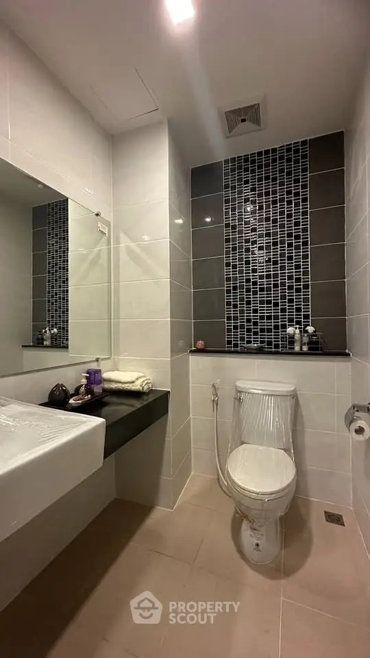Modern bathroom with sleek design and stylish tile accents