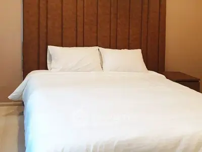 Cozy bedroom with elegant headboard and crisp white bedding