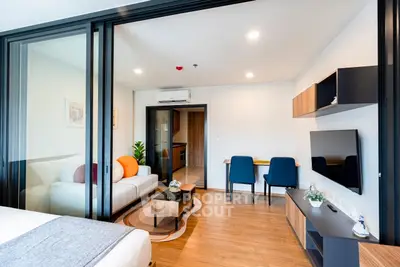 Modern open-plan living room with stylish furniture and natural light