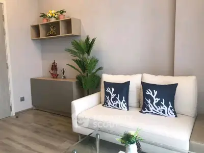 Modern living room with stylish decor and comfortable seating in a bright, inviting space.