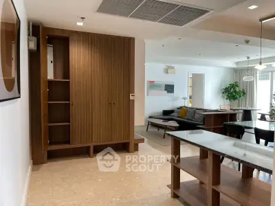 Spacious open-plan living area with modern furnishings and natural light.