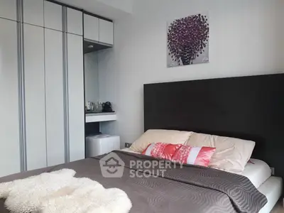 Modern bedroom with stylish decor and built-in wardrobe