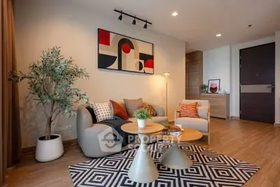 Stylish modern living room with abstract art and cozy seating area.