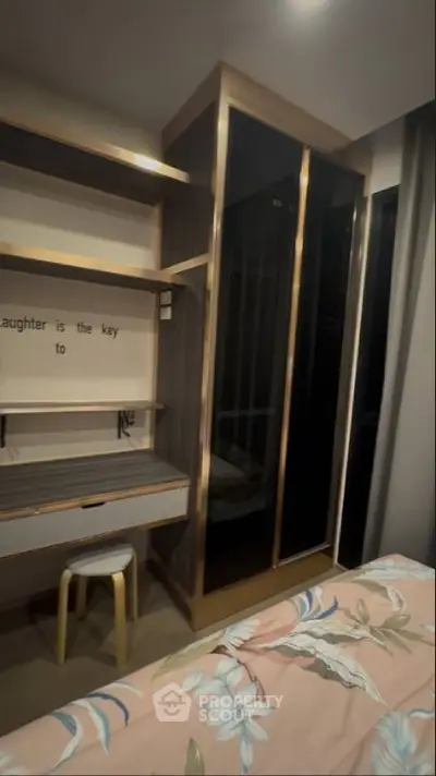 Modern bedroom with built-in wardrobe and stylish desk area