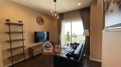 Stylish living room with modern decor and balcony view