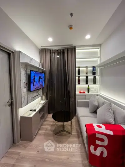 Modern living room with sleek design, cozy sofa, and wall-mounted TV in stylish apartment.
