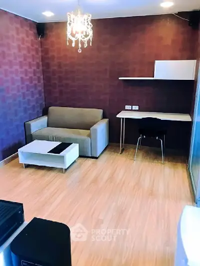 Stylish living room with modern chandelier and cozy seating area