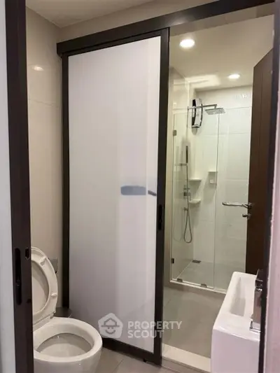 Modern bathroom with glass shower and sliding door