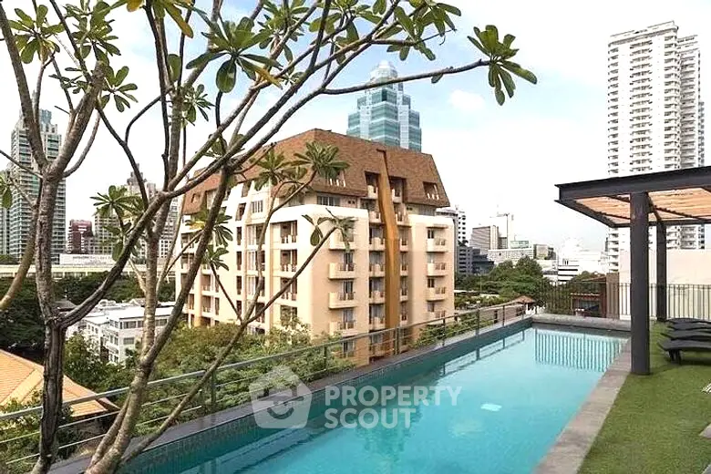 Luxurious rooftop pool with panoramic city views, surrounded by lush greenery and modern amenities, ideal for upscale urban living.