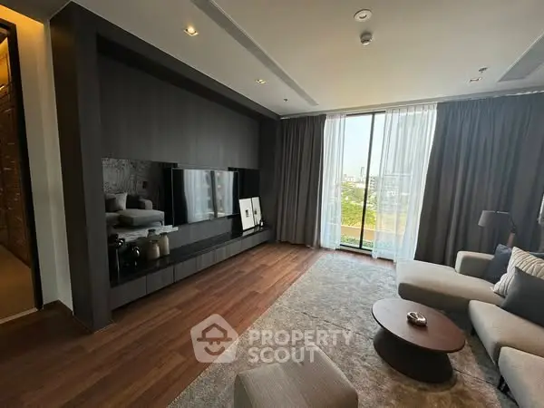Spacious modern living room with large window and stylish decor