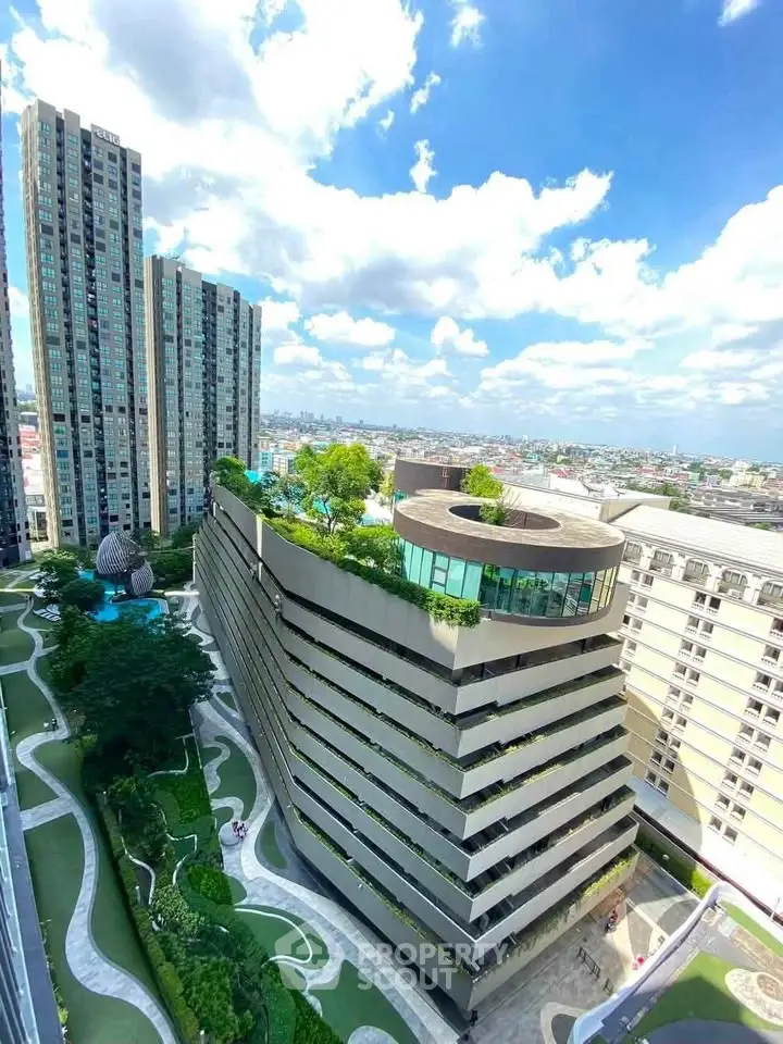 Stunning aerial view of modern high-rise buildings with lush rooftop gardens and scenic cityscape.