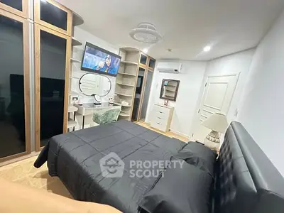 Modern bedroom with sleek black bedding and stylish furniture