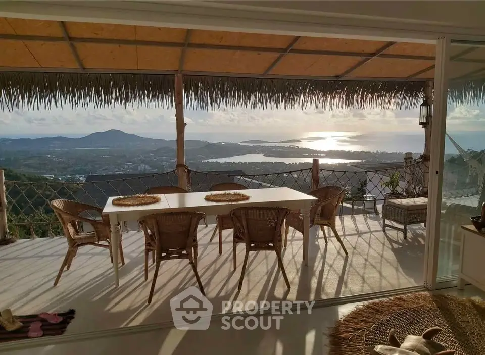 Stunning terrace with panoramic ocean view, perfect for outdoor dining and relaxation.