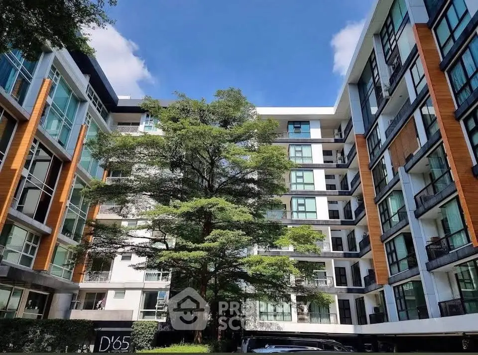 Modern apartment building with lush greenery and contemporary design