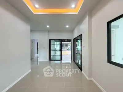 Modern interior with sleek tile flooring and recessed lighting