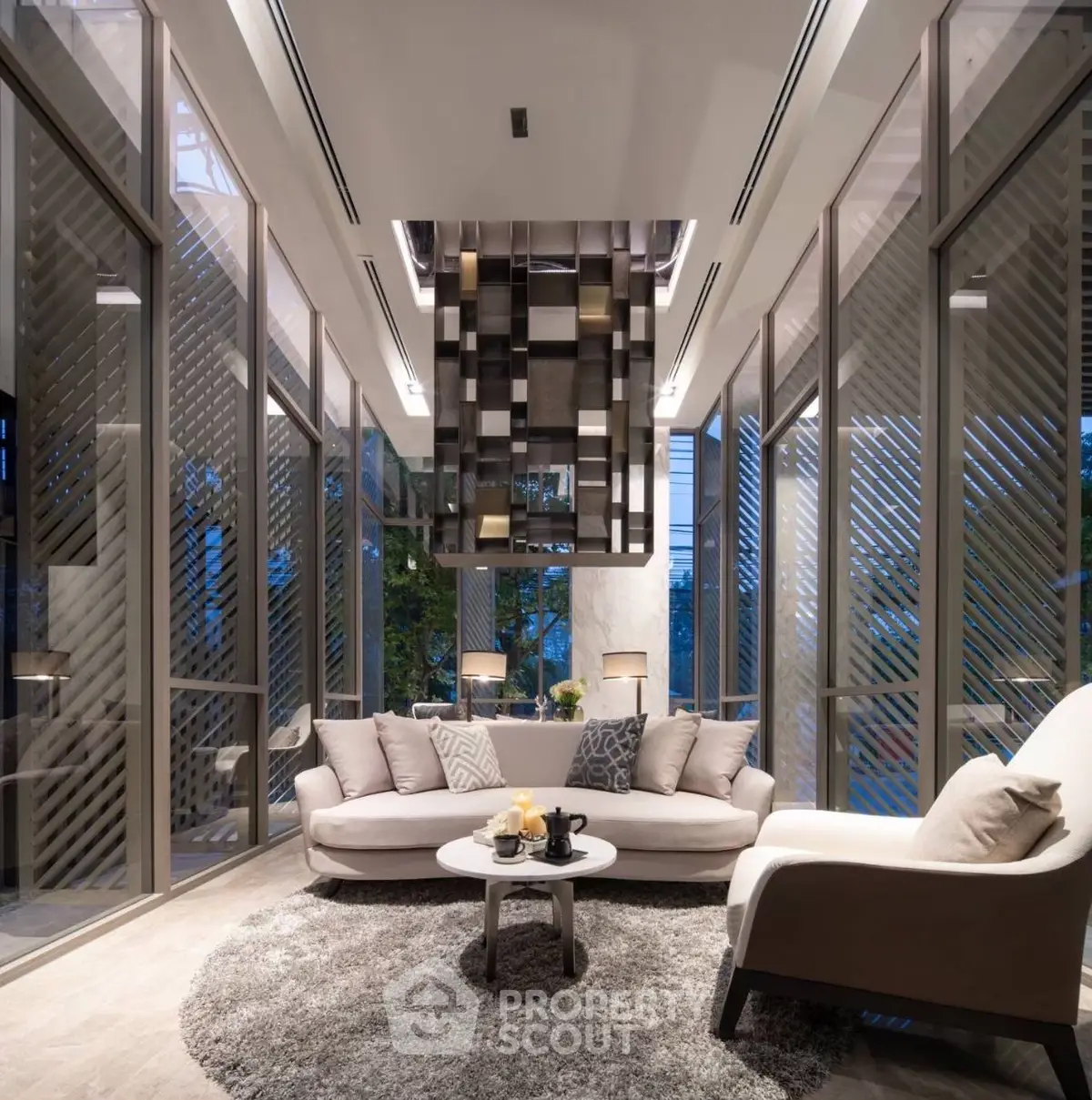 Luxurious modern living room with floor-to-ceiling windows and elegant decor