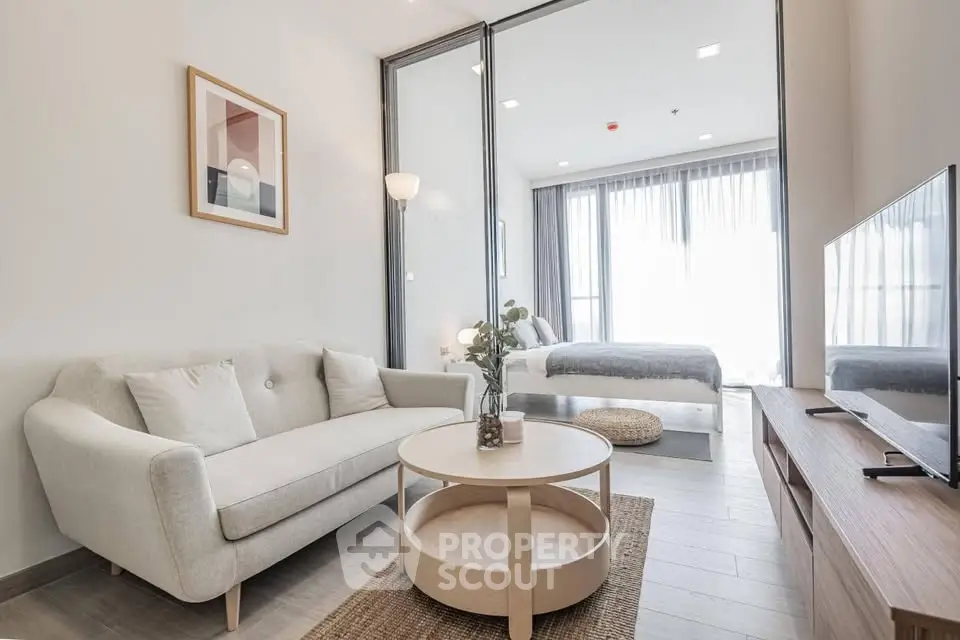 Modern living room with cozy sofa and stylish decor in bright apartment