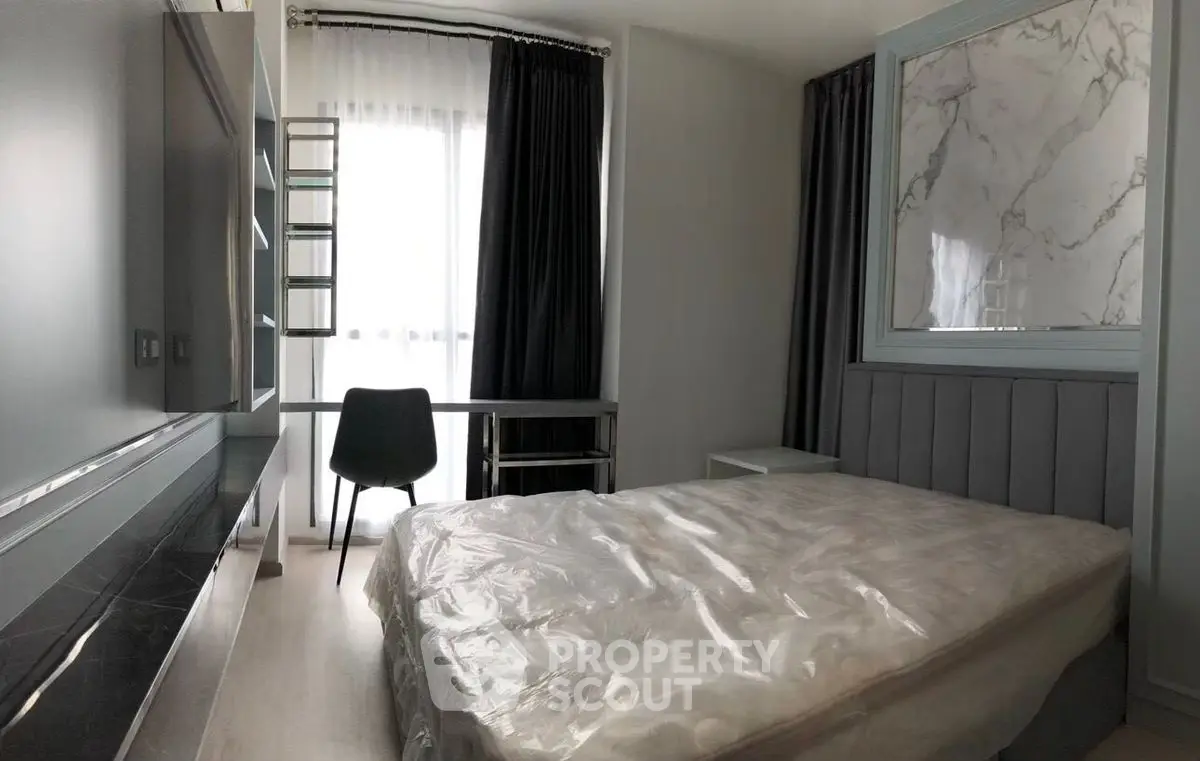 Modern bedroom with stylish decor and natural light