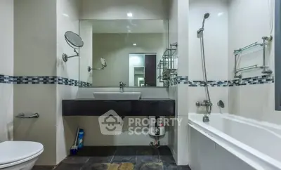 Modern bathroom with sleek fixtures and bathtub in contemporary home