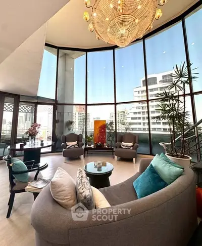 Luxurious living room with panoramic city views and elegant chandelier