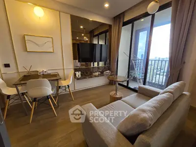 Modern living room with stylish decor and balcony view in high-rise apartment