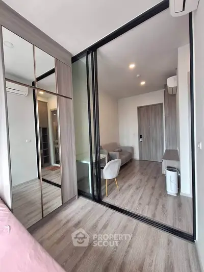 Modern living room with glass partition and stylish decor