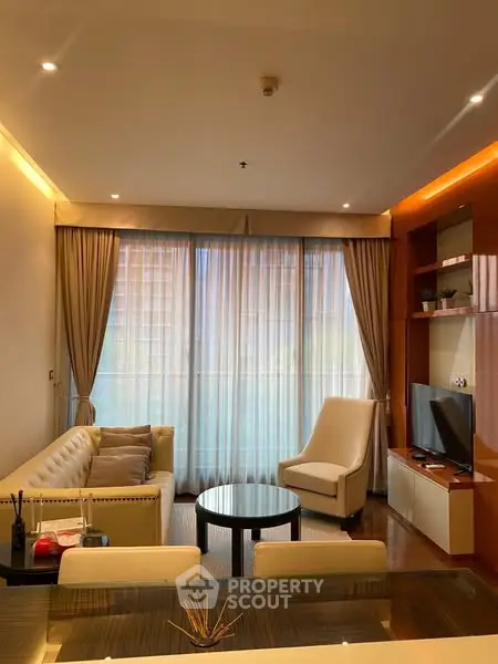 Luxurious living room with elegant decor and large window view