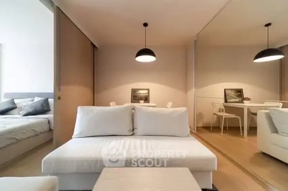 Modern living room with cozy white sofa and elegant decor