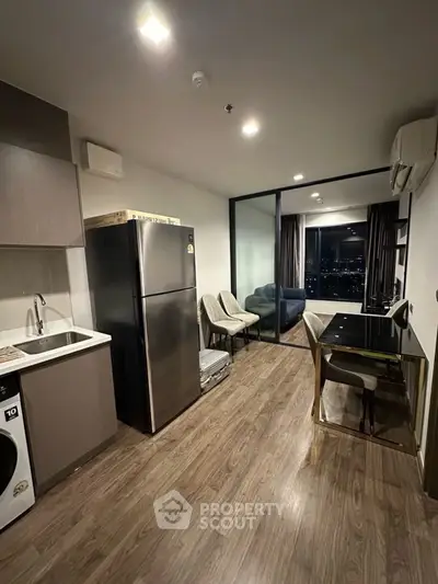 Modern apartment with sleek kitchen and city view from balcony