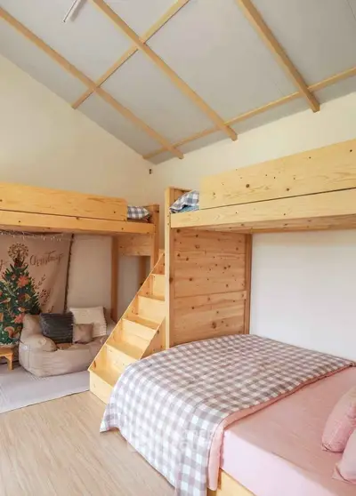 Charming bedroom with cozy bunk beds and warm wooden accents, perfect for a family retreat.