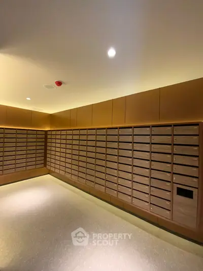 Modern apartment building mailroom with sleek wooden mailboxes