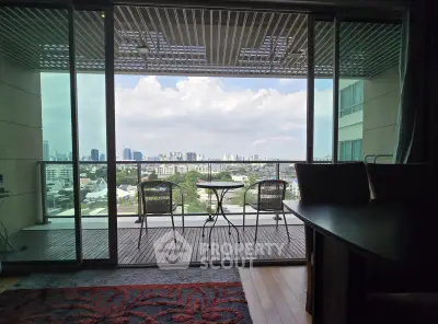 Stunning city view from modern apartment balcony with stylish outdoor seating.