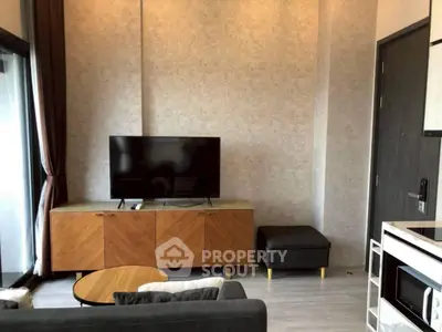 Modern living room with sleek TV setup and stylish furniture