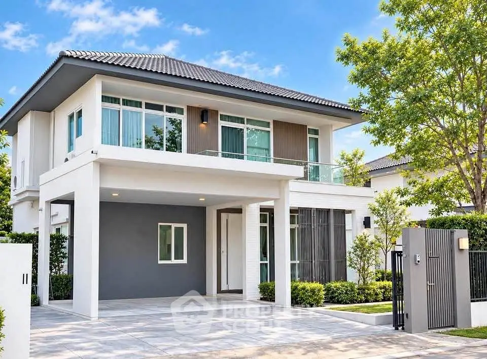 Modern two-story house with sleek design and spacious driveway, surrounded by lush greenery.